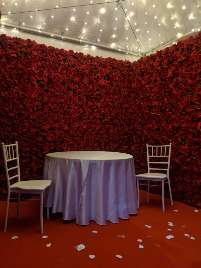 Flower wall rental in toronto decorating  the sweetheart table at a wedding 