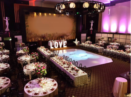 the ballroom at the eglinton grand with a marquee rental that says love