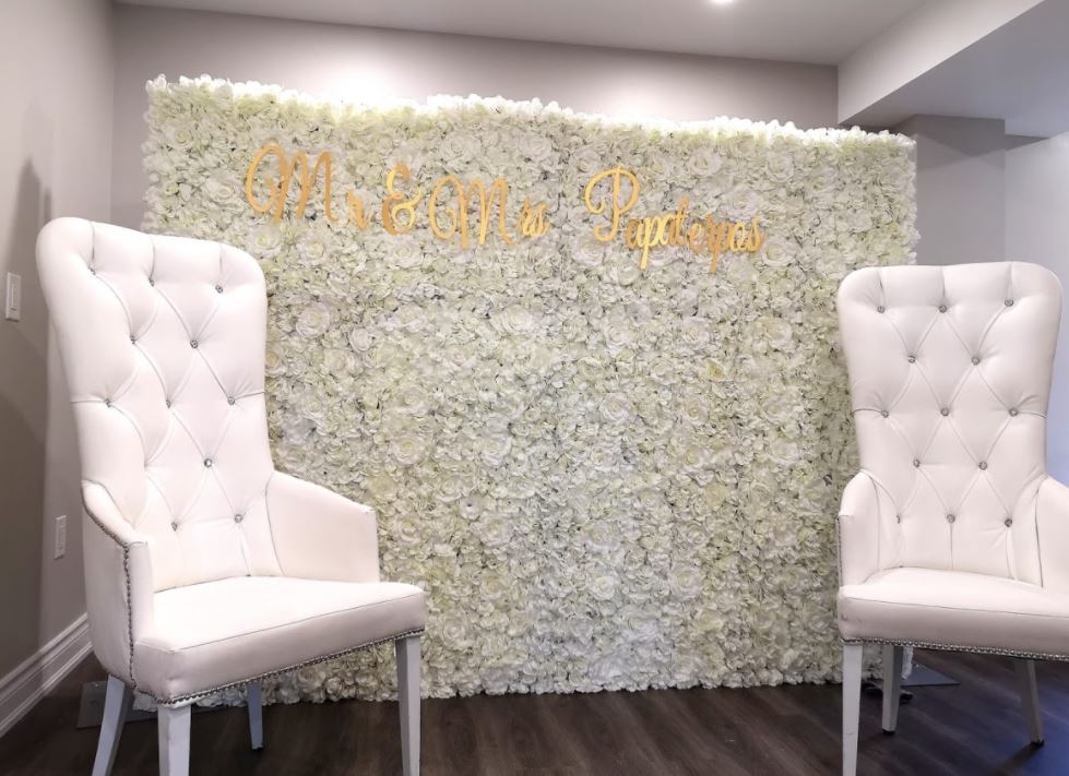 wedding vow renewals in Montreal with white flower wall.  